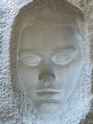 Woman’s head in negative made of white painted metal by HIlde Maehlum.  It is called “Konkavct Ansikt”