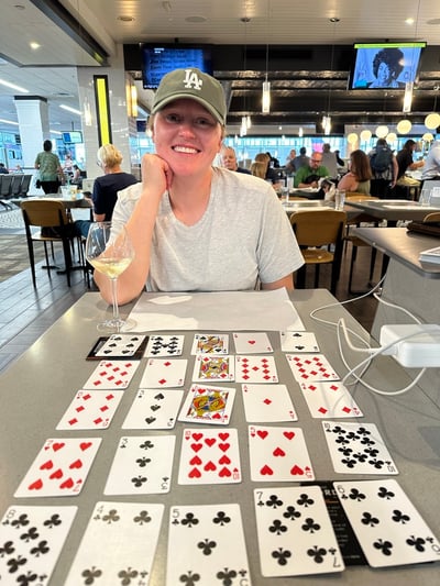 Nicola with cards displayed in front  of here